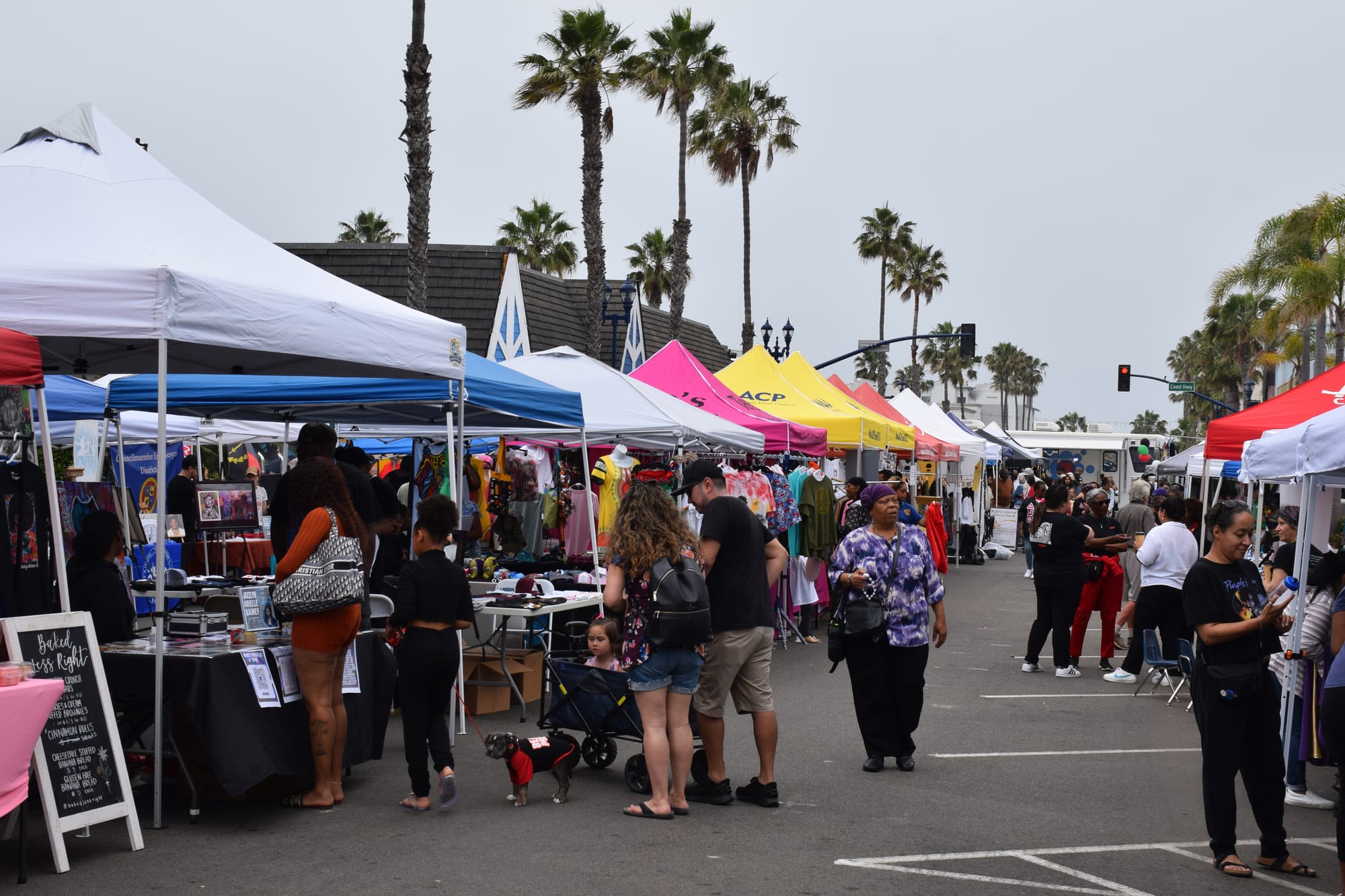 People walk at an outdoor street fair