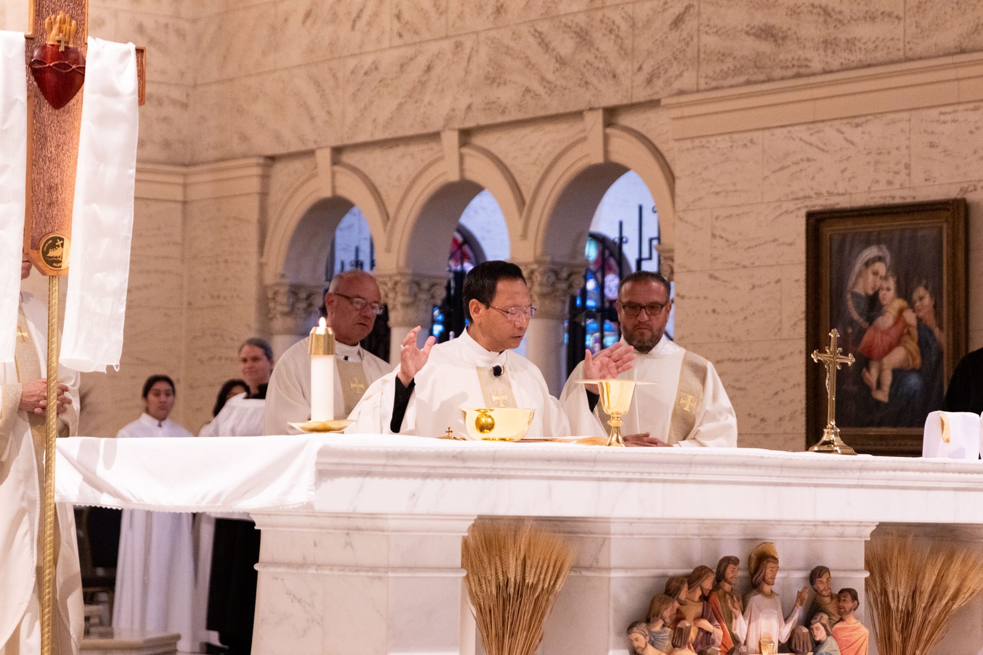A bishop blesses the communion tray in a church