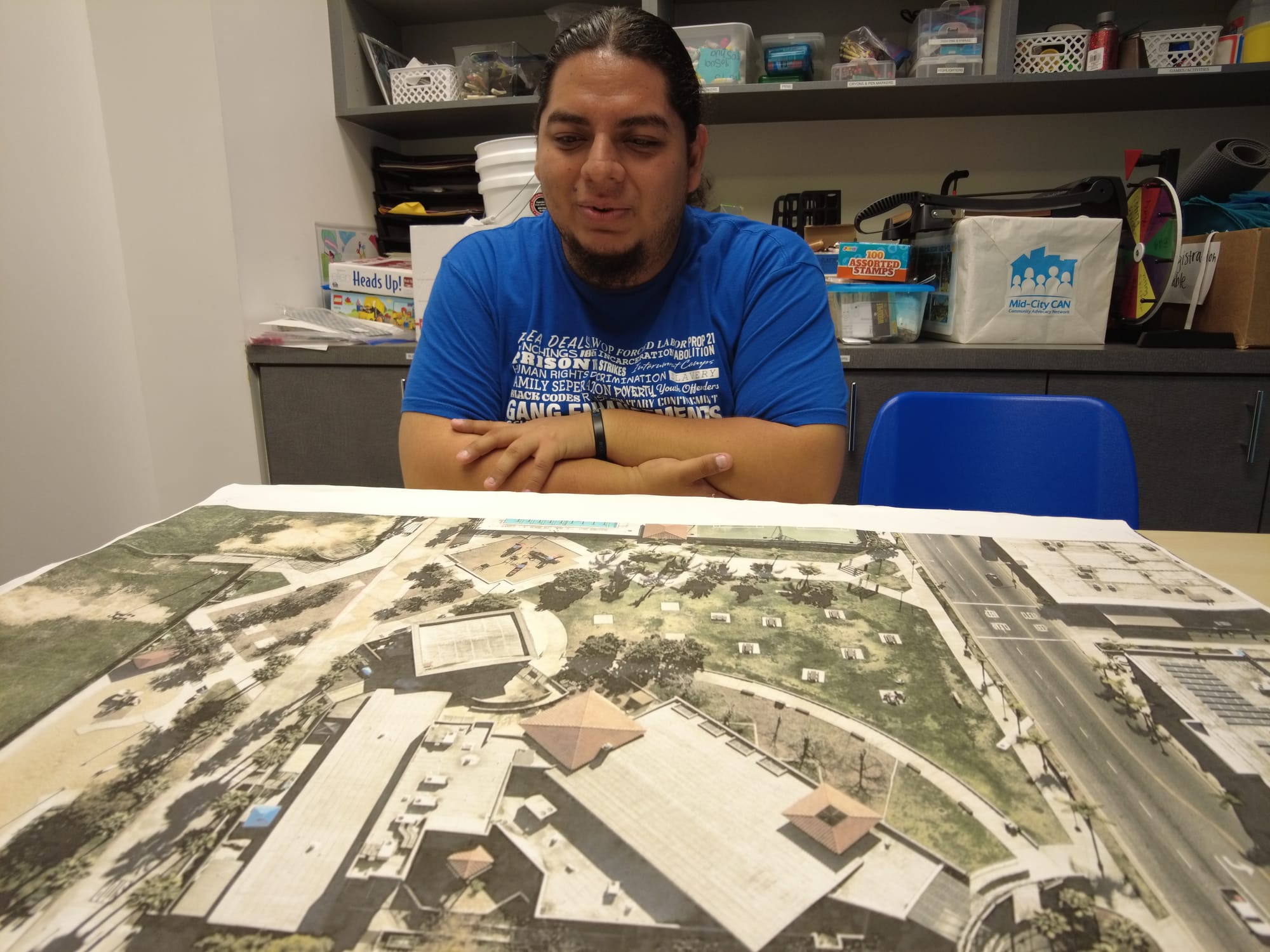 Man sitting with a map spread on table