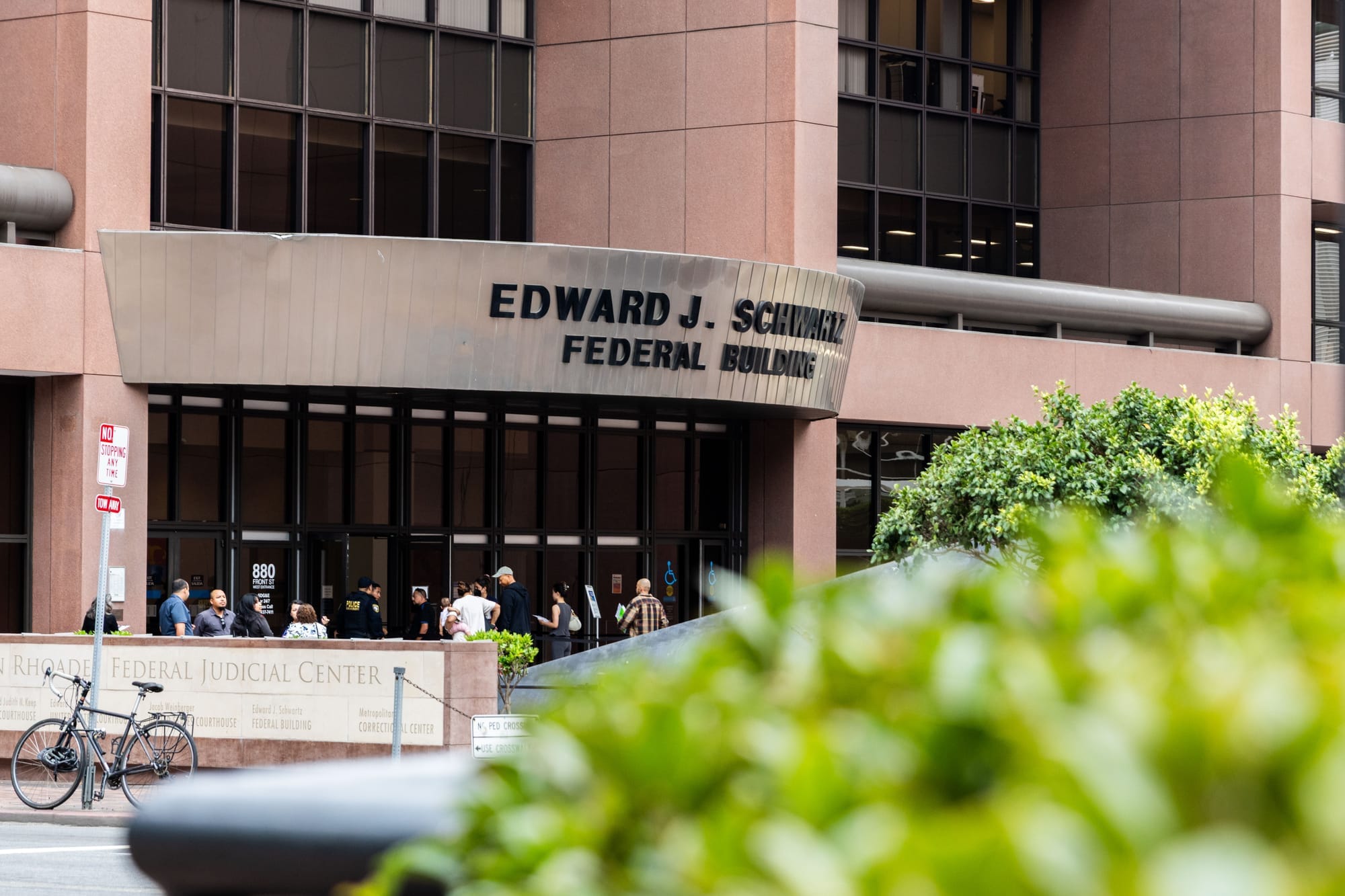Picture of the Edward J. Schwartz Federal Building with a bush in front of it
