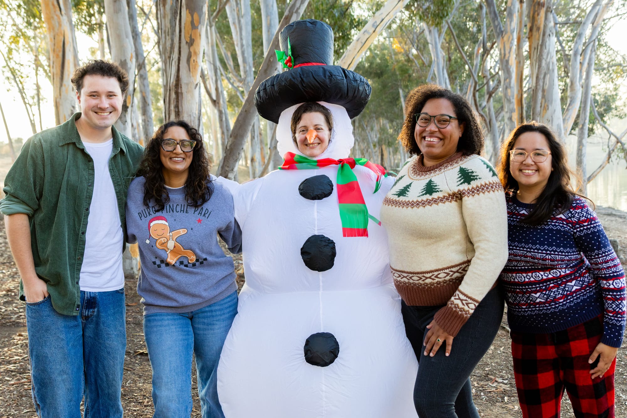 Image of five people with one in a snowperson costume