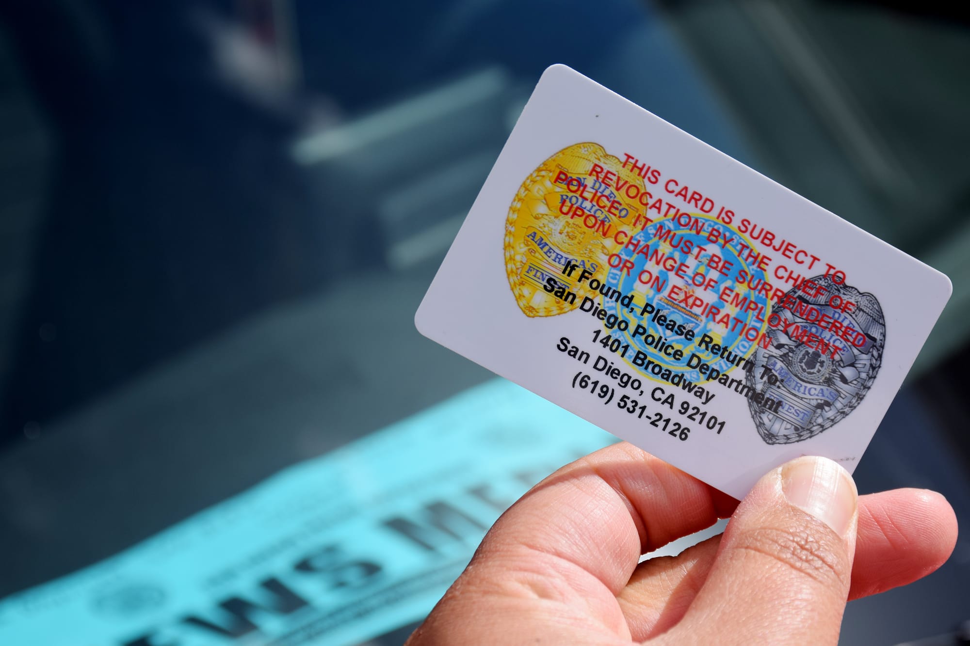 Picture of an identification card with words “This card is subject to revocation by the chief of police. It must be surrendered upon change of employment or on expiration.”