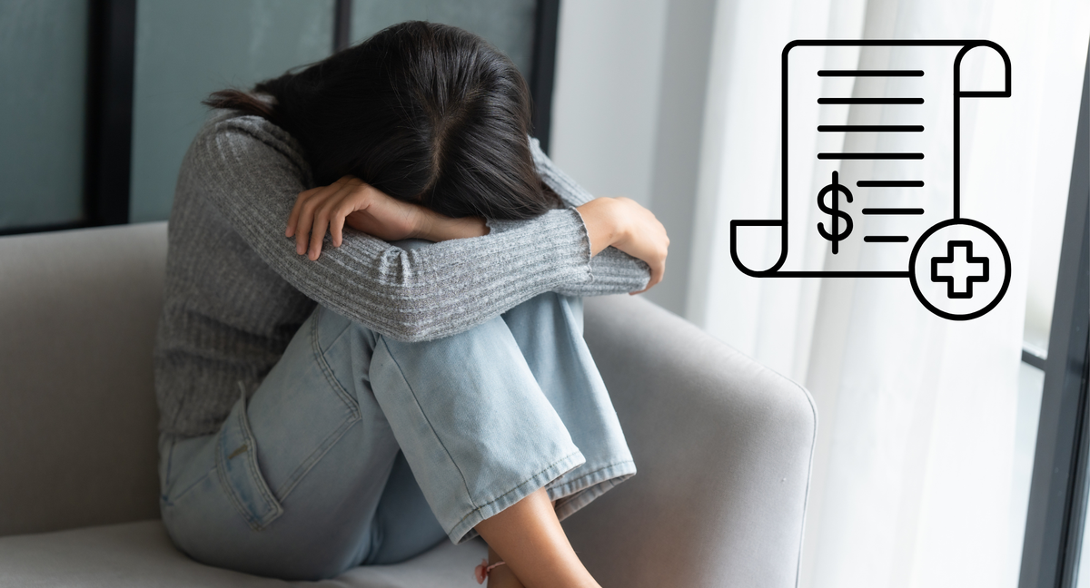 A child rests their head between their knees with arms crossed, solemnly. A medical bill looms in the corner.