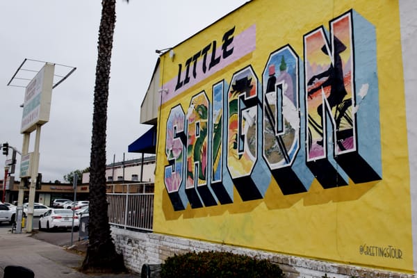painting of a mural that says little saigon with images painted within each letter