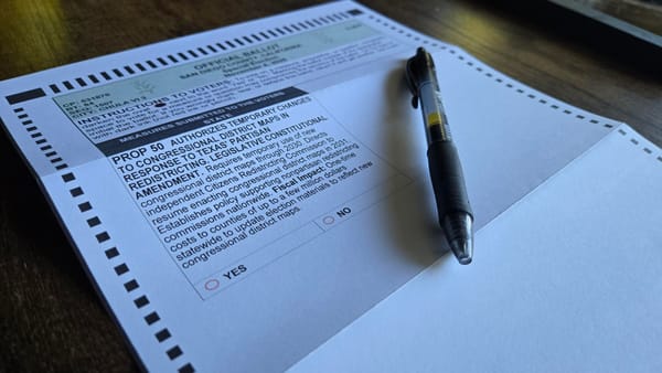 Picture of a pen with a ballot that reads: Prop 50 authorizes temporary changes to congressional district maps in response to Texas' partisan redistricting. 
