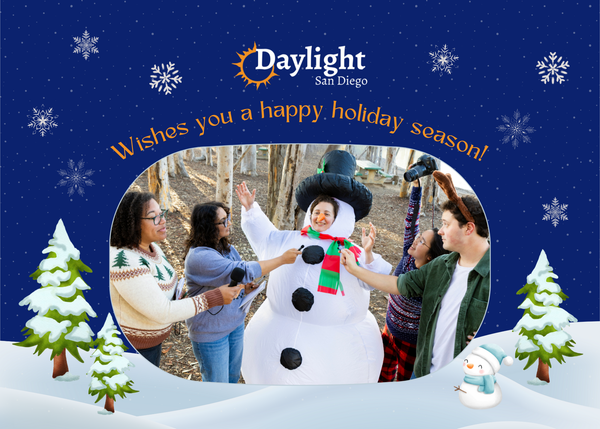 Illustration with digital drawings and a photograph of four people interviewing someone in a snowperson costume with the words "Daylight San Diego wishes you a happy holiday season!"